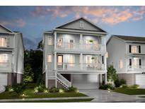 Two-story home with gray siding, balconies, and a detached garage at 1695 Cultivation Lane St # 463, Mount Pleasant, SC 29466