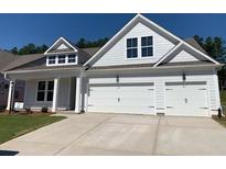 Two-story home with white siding, three-car garage, and landscaping at 782 Maynard Ln, Summerville, SC 29486