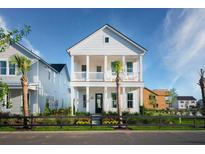 Two-story home with white siding, front porch, and landscaping at 1447 Clay Field Trl, Summerville, SC 29485