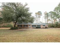 Brick ranch home with large yard and mature trees at 106 Reardon Ave, Walterboro, SC 29488