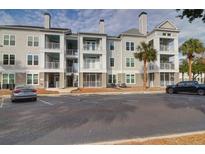 Apartment building exterior with parking and landscaping at 130 River Landing Dr # 9110, Charleston, SC 29492