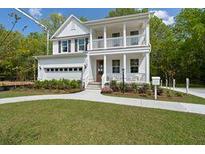 Two-story house with front porch and landscaped yard at 768 Maynard Ln, Summerville, SC 29486