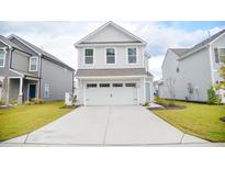 Two-story house with a white garage door and light beige siding at 156 Surfbird Rd, Summerville, SC 29486