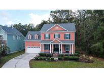 Charming two-story home with a welcoming front porch and landscaped yard at 260 Carolinian Dr, Summerville, SC 29485