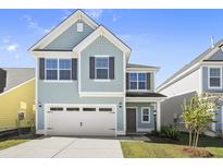 Charming two-story home with a welcoming front porch and attached garage at 773 Opal Wing St, Moncks Corner, SC 29461