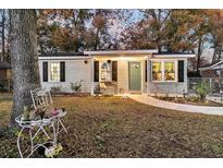 Charming single-story home with a covered porch and landscaped front yard at 107 Dorchester Manor Boulevard, North Charleston, SC 29420