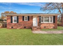 Charming brick home with a lush green lawn and updated windows at 442 Annette Dr, Goose Creek, SC 29445