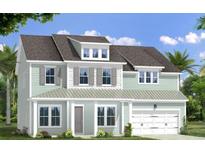 Two-story light green house with gray roof, white garage door, and landscaping at 9236 Blue Jay Ln, Awendaw, SC 29429
