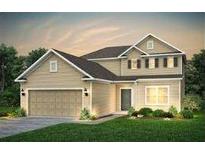 Two story house with beige siding, brown roof, and a two car garage at 147 Royal Cainhoy Way, Huger, SC 29450