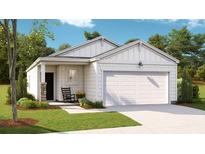 One-story home with white siding, a two-car garage, and a welcoming front porch at 304 Tiliwa Street, Summerville, SC 29486