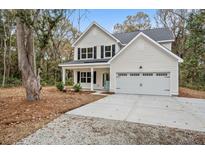 Two-story house with gray roof, white siding, and a two-car garage at 929 Long Point Rd, Mount Pleasant, SC 29464