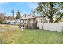 Charming one-story house with a porch and fenced yard at 2735 Constitution Ave, North Charleston, SC 29405