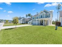 Two-story home with front porch and landscaped lawn at 153 Belfort Pl, Summerville, SC 29486