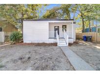 Newly renovated craftsman style home with front porch and landscaping at 2208 Bailey Dr, North Charleston, SC 29405