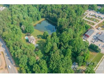 House with private pond and wooded acreage at 1228 Brawley School Rd, Mooresville, NC 28117