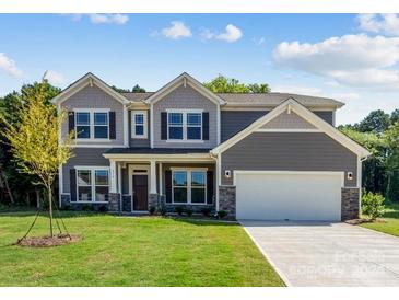 Two-story home with gray siding, white trim, and a two-car garage at 236 Winford Rd, Troutman, NC 28166