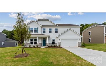 Two story house with white siding and stone accents at 230 Winford Rd, Troutman, NC 28166