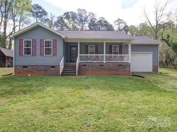 Photo one of 715 S Church St Lowell NC 28098 | MLS 4124481