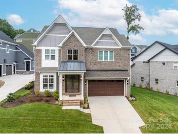 Two-story brick home with attached garage at 811 Naples Dr, Davidson, NC 28036