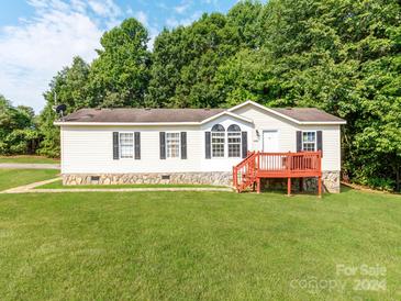 Single wide mobile home with a deck and large yard at 2353 Sweet Pea Ln, Lincolnton, NC 28092