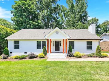 Charming white brick ranch home with manicured lawn at 6639 Ronda Ave, Charlotte, NC 28211