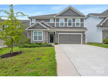 Two-story home with gray siding and stone accents at 116 Hornbeam Ln, Mooresville, NC 28117