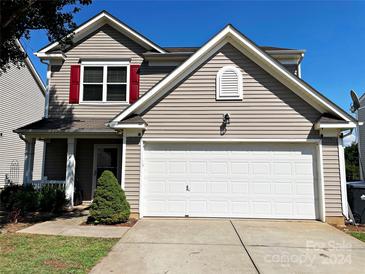 Two-story house with a large garage and landscaping at 416 Galesburg Dr, Monroe, NC 28110