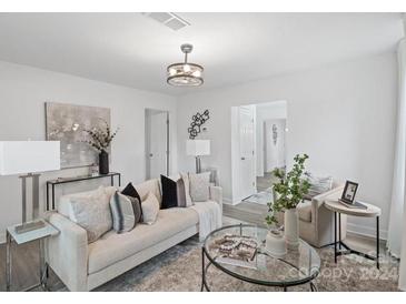 Bright living room with comfy seating, large windows, and modern decor at 477 Frank St, Rock Hill, SC 29730