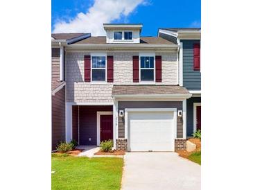 Modern two-story townhome with red shutters at 2778 Yeager Nw Dr, Concord, NC 28027