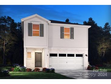 Two-story house with white siding and a two-car garage at 490 Olympia Way, York, SC 29745