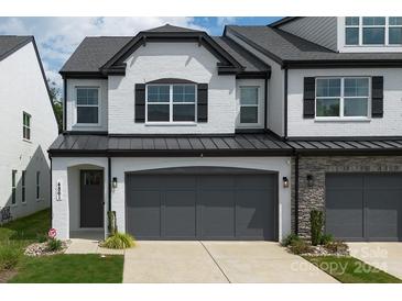 Modern 2-story townhome with gray roof and black accents at 4861 Blanchard Way, Charlotte, NC 28226