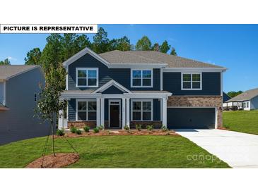 Two-story house with dark blue siding, brick accents, and a two-car garage at 115 Saidin Ln, Troutman, NC 28166