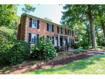 Brick home with landscaped yard and walkway at 224 Sudley Cir, Salisbury, NC 28144