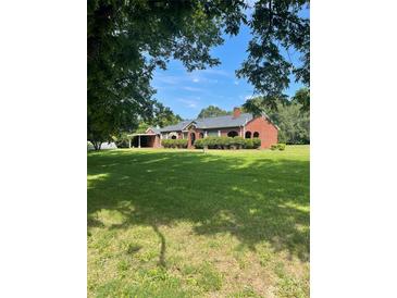 Brick ranch house with large yard and covered porch at 500 W 22Nd St, Kannapolis, NC 28081