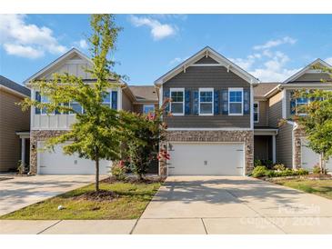 Modern two-story townhome with two-car garage at 2465 Palmdale Walk Dr, Fort Mill, SC 29708