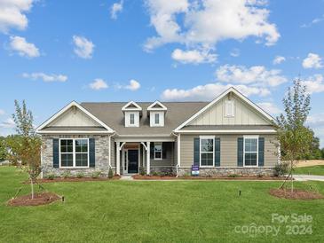 Charming two-story home with stone accents and a landscaped lawn at 1165 Coppergate Dr, Salisbury, NC 28147