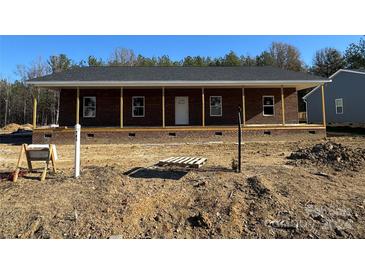 Brick ranch house with a front porch and large windows at 745 Grier St, Rock Hill, SC 29730