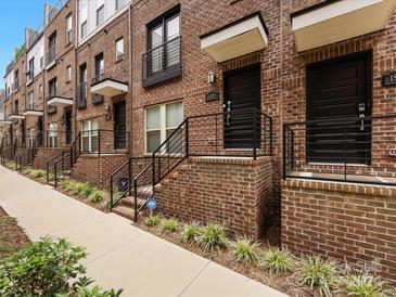 Brick townhouses with private entrances and walkways at 15021 New Amsterdam Ln, Charlotte, NC 28204