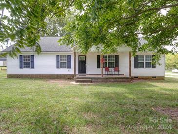 White home with covered porch, and landscaping at 4616 Canal Rd, Marshville, NC 28103