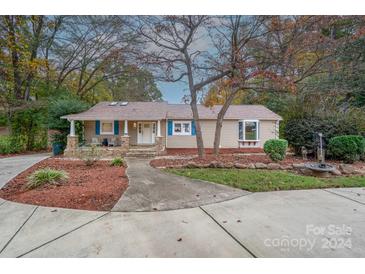 Charming ranch home with stone walkway and landscaping at 9556 Riviera Dr, Sherrills Ford, NC 28673