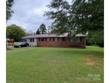 Brick house exterior with a large grassy yard at 309 Bost Nursery Rd, Maiden, NC 28650