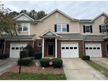 Brick front exterior of townhome with two-car garage at 5346 Johnston Mill Ct, Charlotte, NC 28269