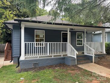 Quaint bungalow with a covered porch and updated exterior at 2216 Tate St, Charlotte, NC 28216