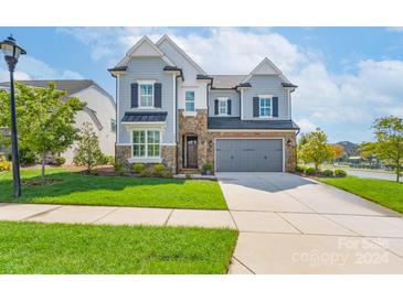 Two-story home with gray siding and stone accents at 1012 Thatcher Way, Fort Mill, SC 29715