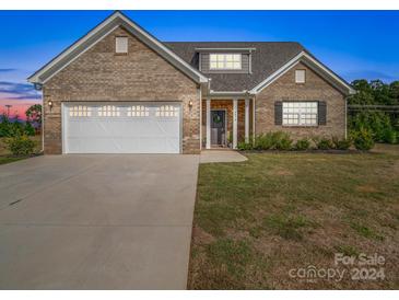 Brick ranch home with a two-car garage at 3810 New Salem Rd, Monroe, NC 28110