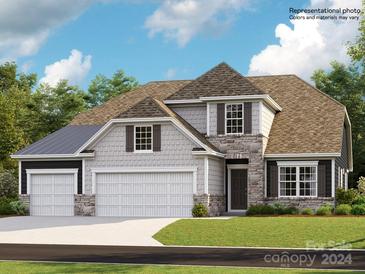 Two-story house with three-car garage and stone accents at 1597 Croyden St # 326, Indian Land, SC 29707