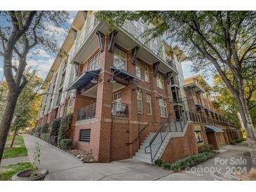 Brick building with multiple units and a stairway at 1101 W 1St St # 216, Charlotte, NC 28202