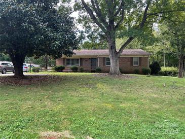 Brick ranch home with mature trees and a large yard at 2808 Findley Rd, Statesville, NC 28625