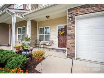 Inviting front porch with seating area, stone accents, and landscaping at 171 Limerick Rd # C, Mooresville, NC 28115