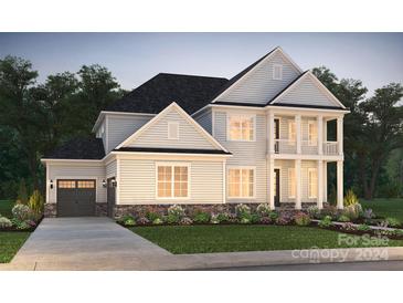 Two story home with gray siding and landscaping at 12151 Old Cottonwood Ln # 36, Huntersville, NC 28078